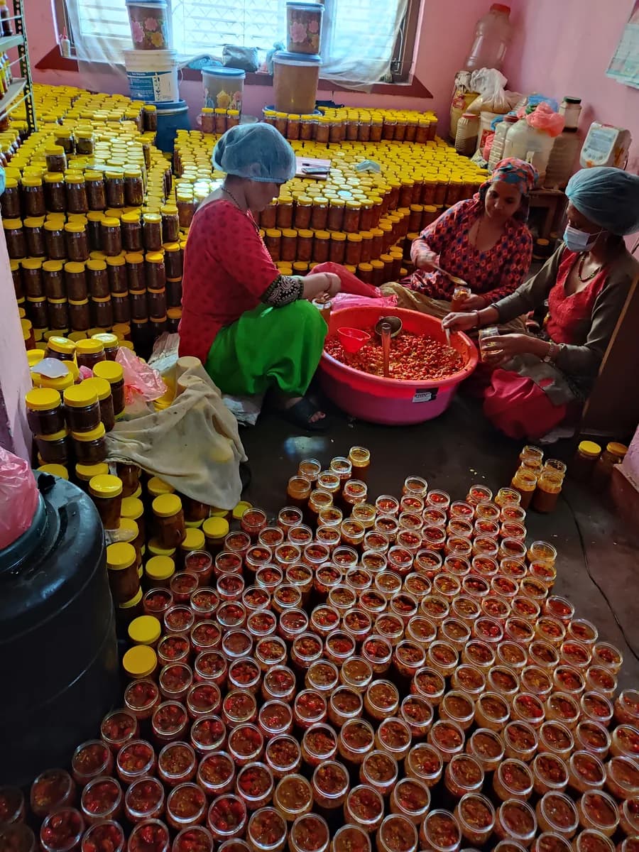 Women packing My Pickle House jars